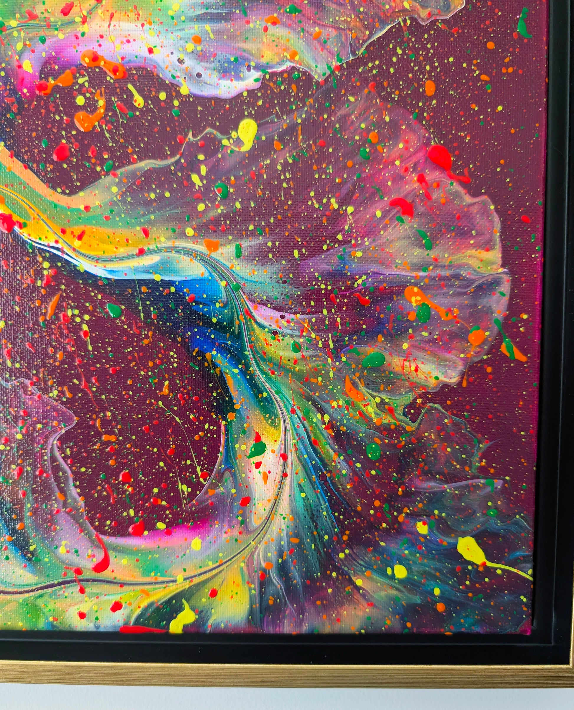 Close-up of 'I Wish I Had Your Confidence,' showing detailed swirls of neon green, yellow, and pink on a rich magenta base, accented by splatters of orange, red, and yellow.