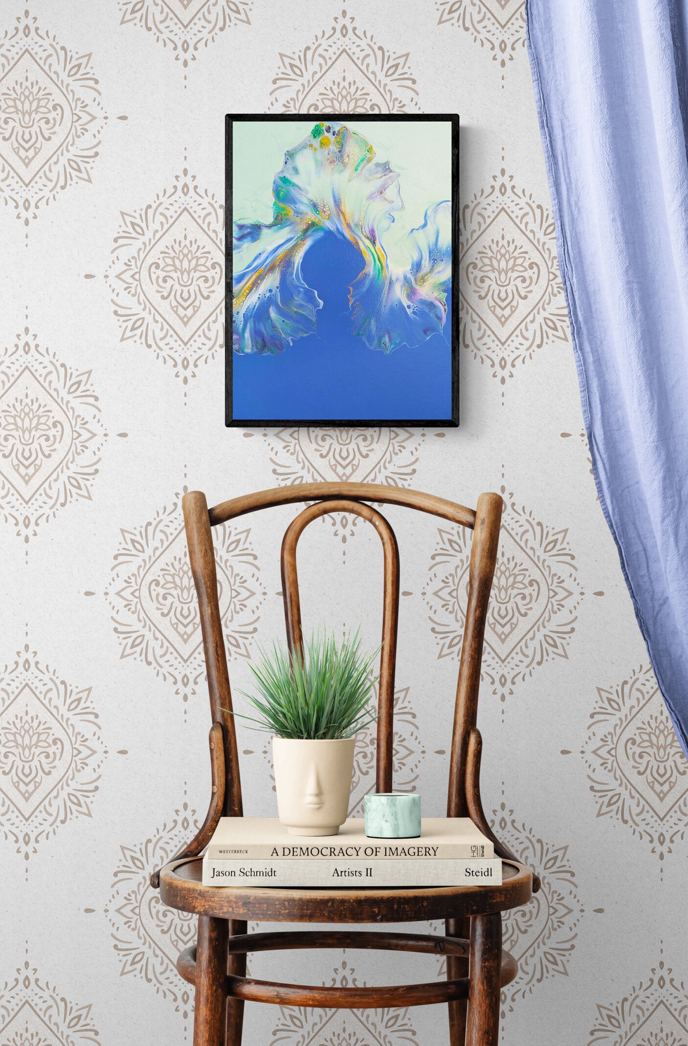 Lavender Fields – abstract fluid art print in soft lavender, green, and blue, framed wall decor styled above a rustic chair with books and plant.