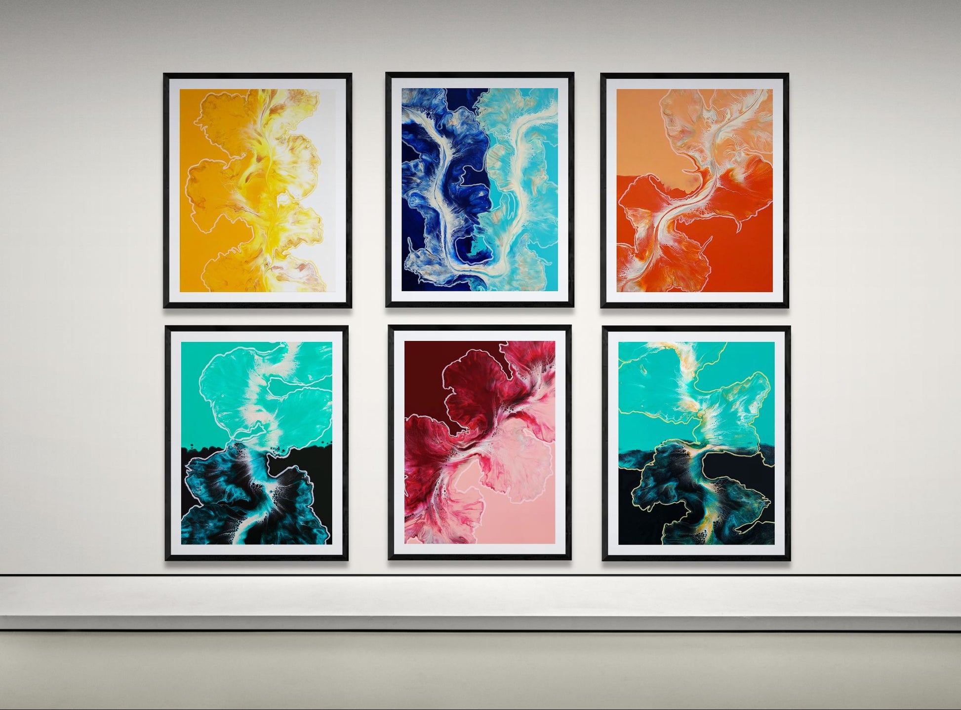 Set of six abstract fluid art prints from the Lines Collection framed in black hanging on a white wall