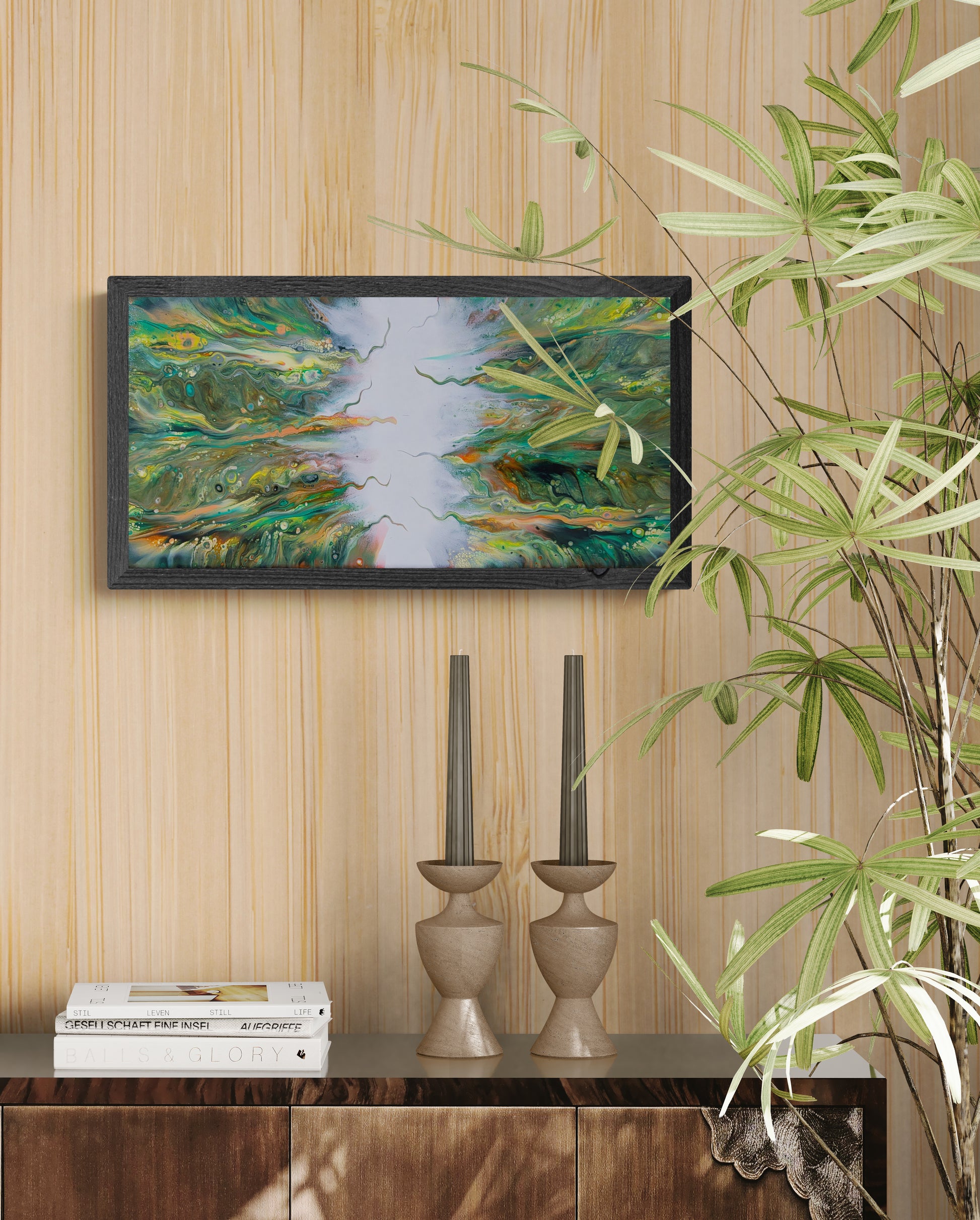 Lush original fluid art painting framed in black, styled above a wooden sideboard with mid-century decor and indoor plants.