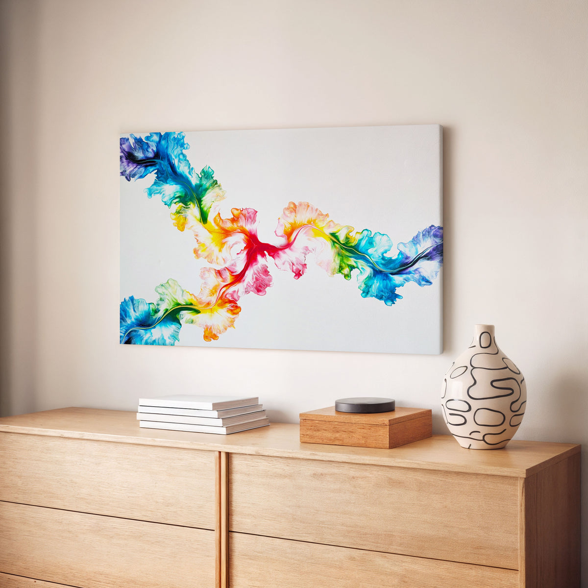 Never Dim Your Light, an original fluid painting by Abby May, shown in a room above a wood dresser beside a patterned vase.
