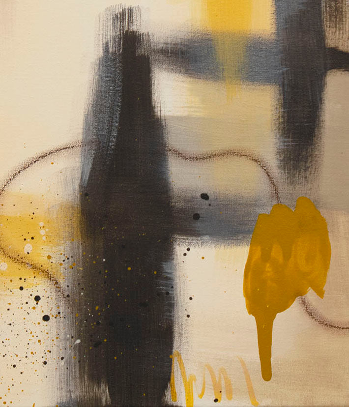 Artistic macro shot of "Ochre Drift" by Abby May, capturing the interplay between the deep raw umber paint and delicate, atmospheric golden splatters.