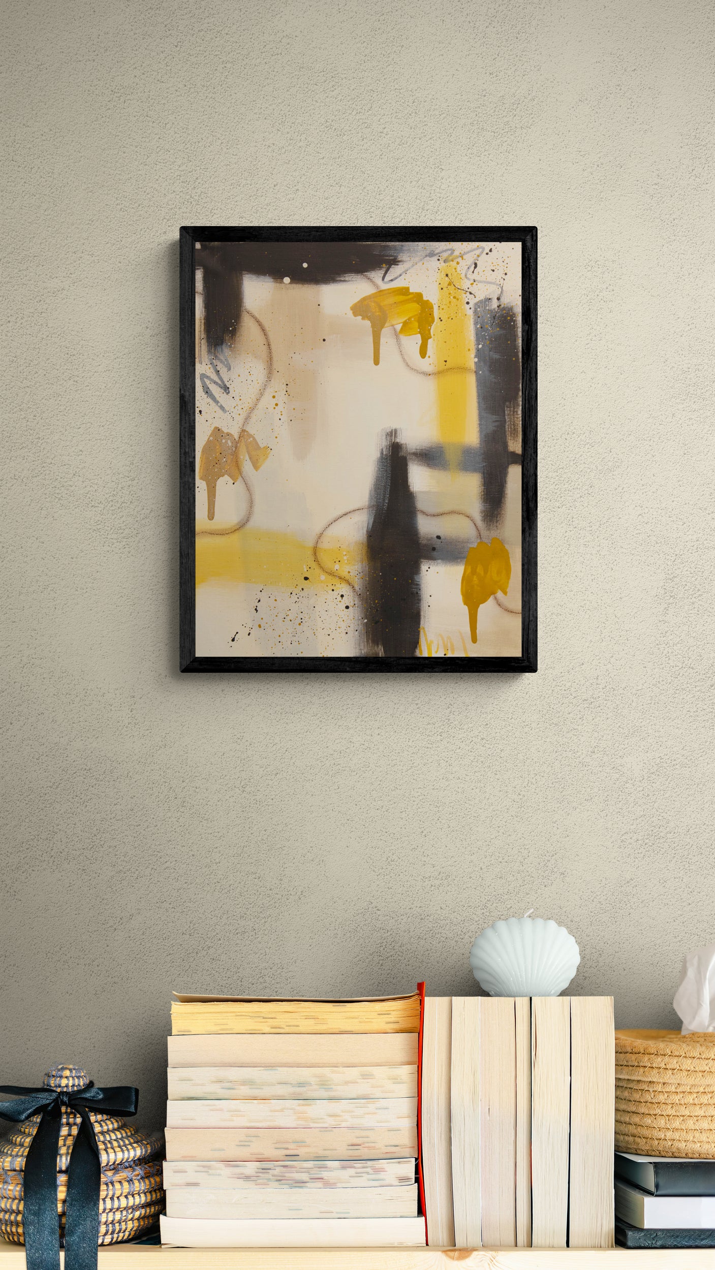 "Ochre Drift" by Abby May styled in a cozy reading nook above books, demonstrating how the golden ochre tones and oil pastel lines add a warm, organic feel.