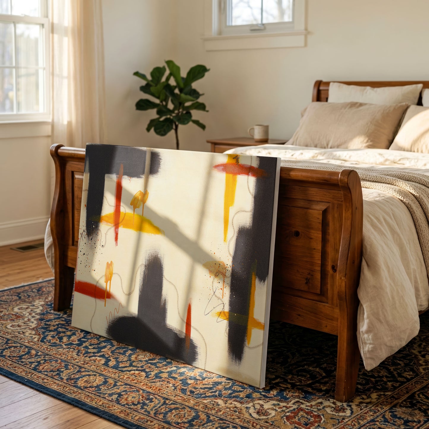 A canvas print of the painting staged in a minimalist bedroom. The canvas sits on a patterned blue rug, leaning against a wooden bedframe. There are tan and white sheets and blankets on the bed with a potted tree in the background.