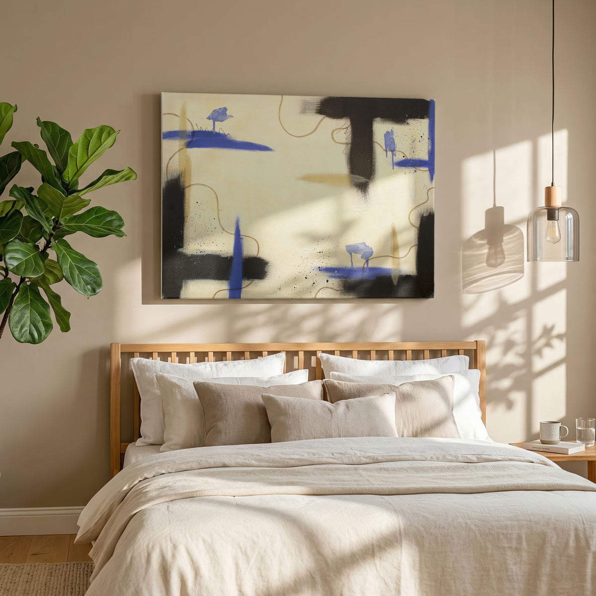 A large canvas print of the painting hanging over a bed with a simple wooden frame. The sheets on the bed are various shades of cream and white. On the left is a potted tree, and on the right is a hanging lamp over a simple wooden side tablewith a coffee mug, book, and glass of water.