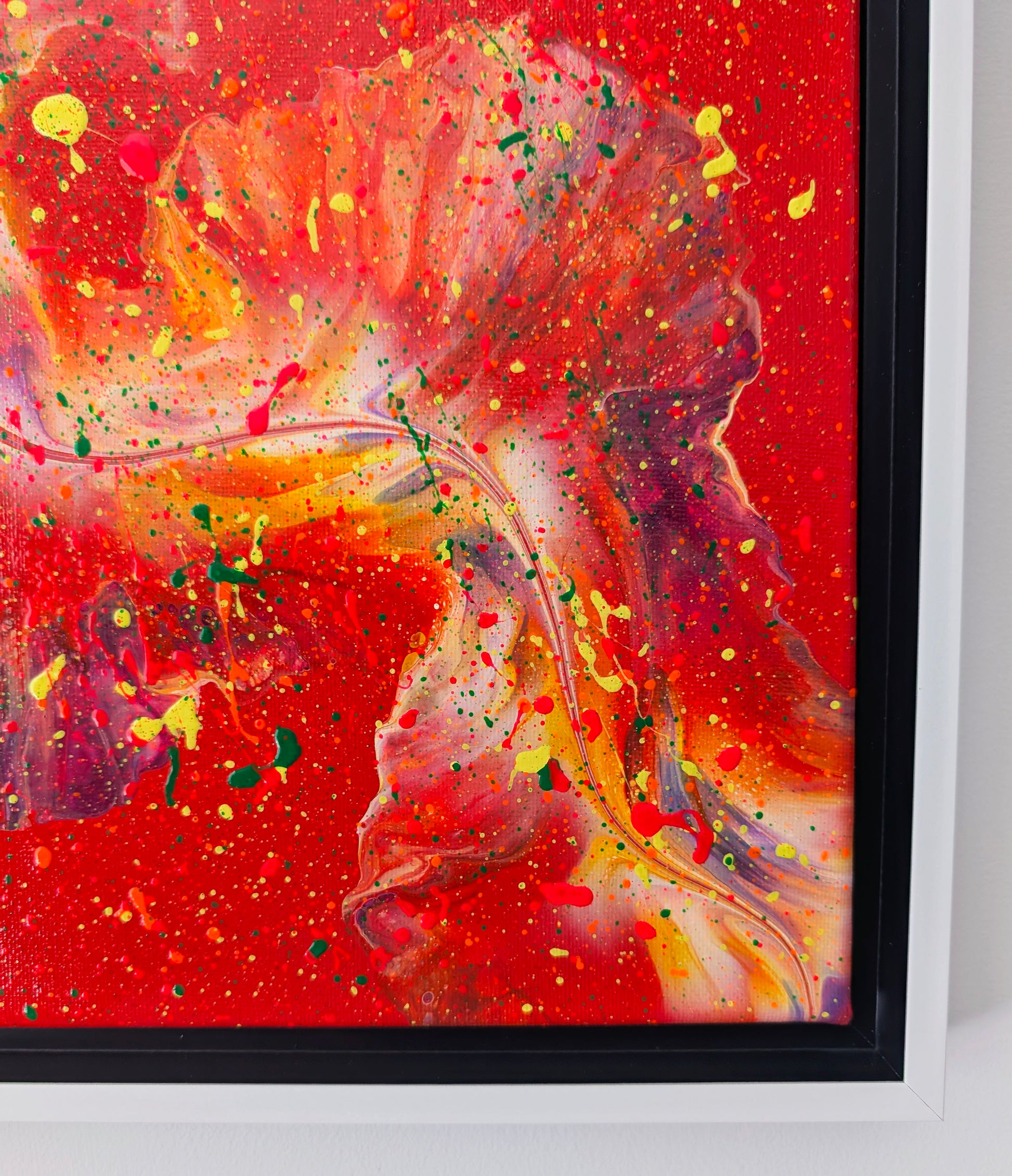 Detailed close-up of the painting’s lower section showing swirling purple and orange forms with neon yellow and green splatter over a rich red background.