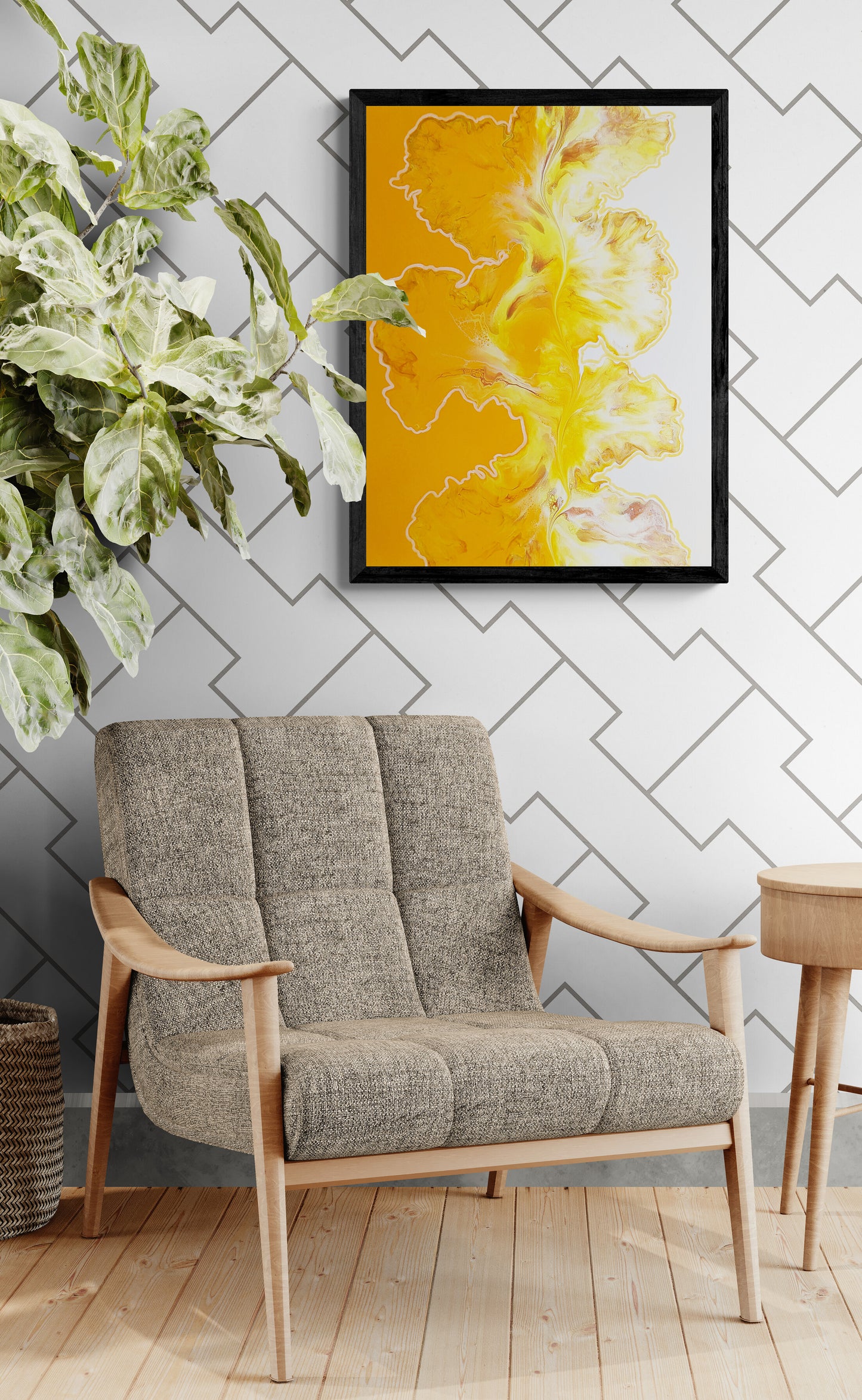 Abstract fluid art print framed in black, hanging above a mid-century chair with a potted plant beside it and light wood flooring.
