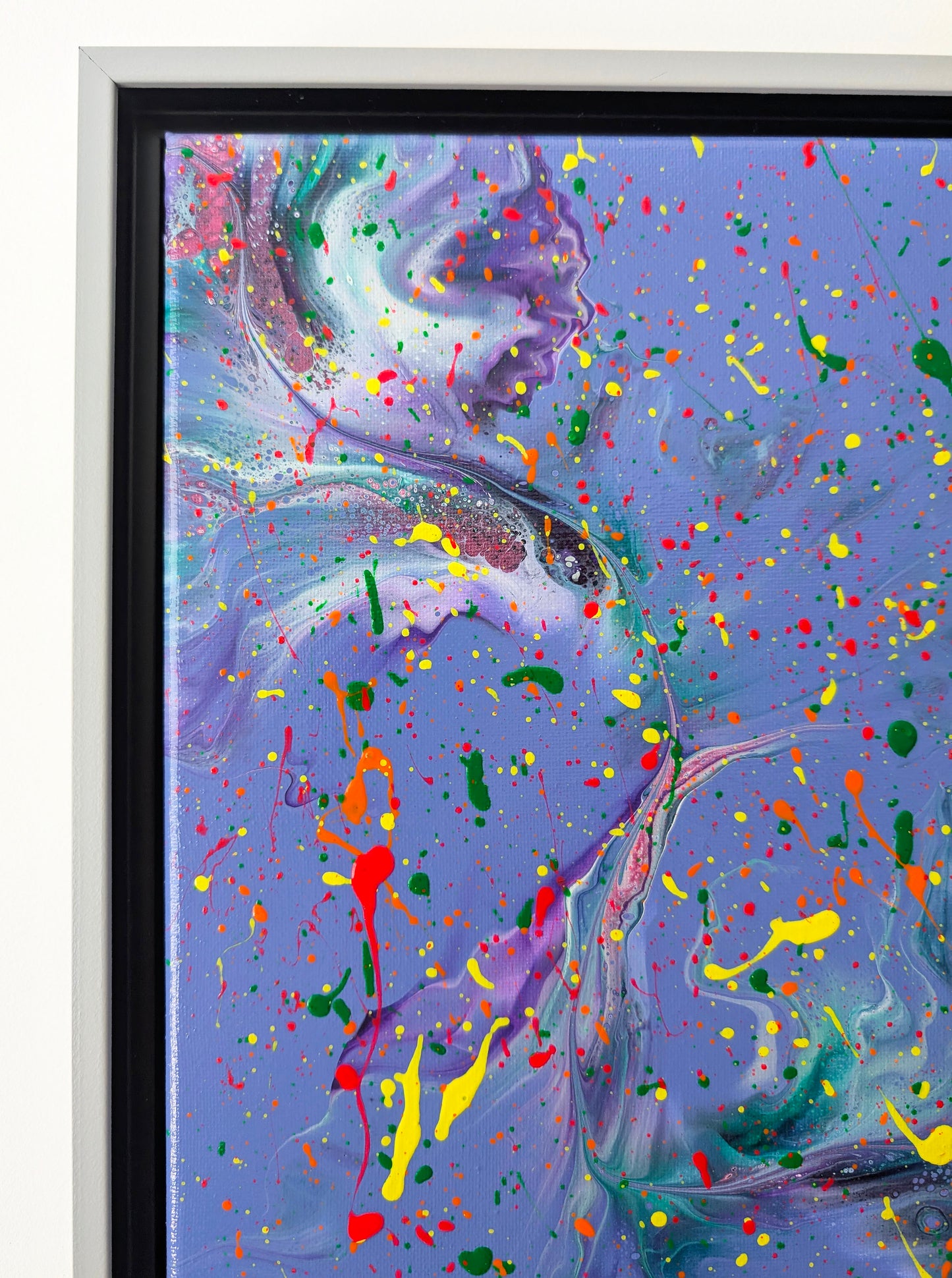 Close-up of the upper left corner of the painting, showing detailed swirls of lavender, teal, and white. Bright paint splatters in yellow, red, and green create an intense, playful overlay.