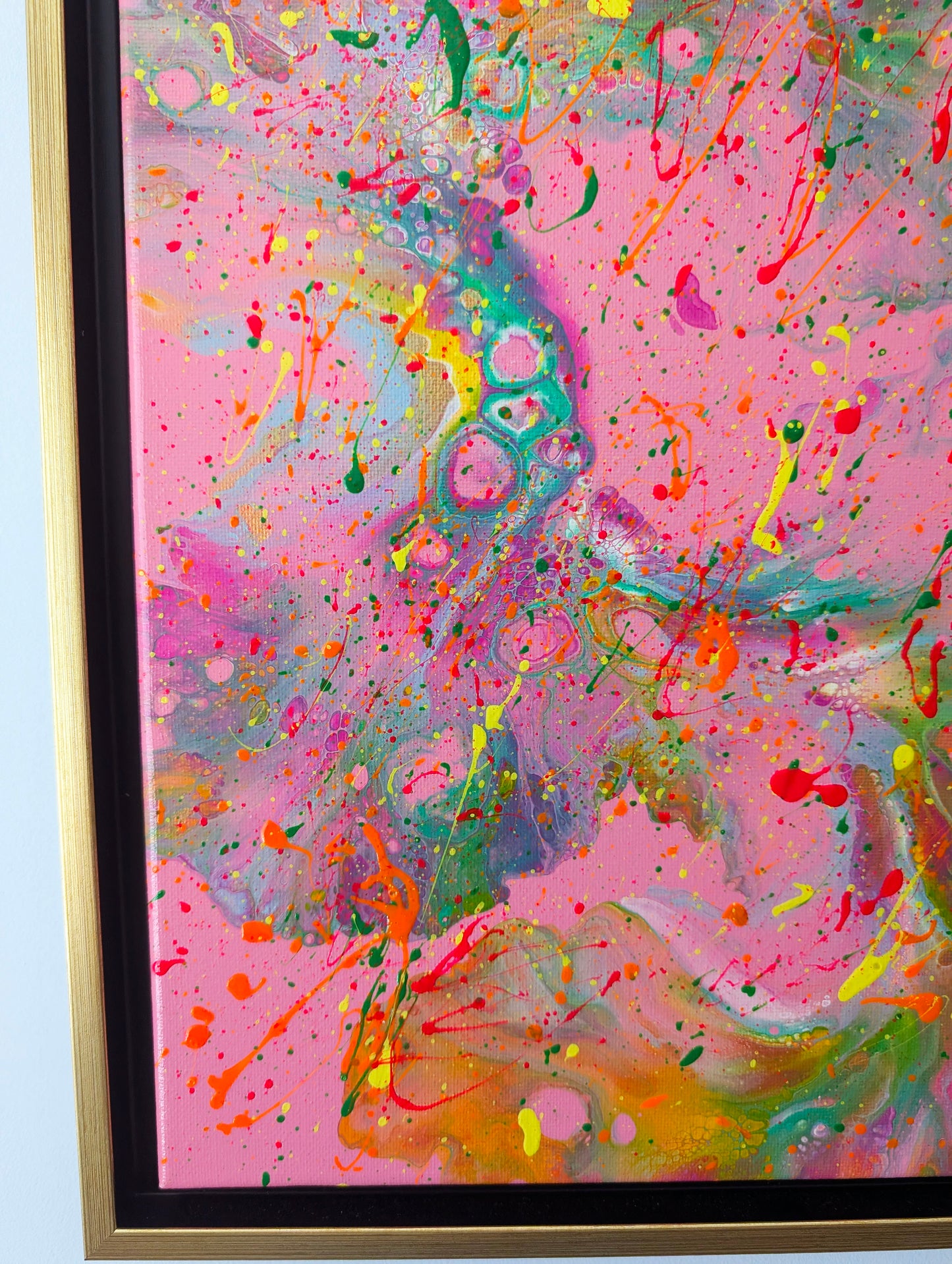 Close-up of the left side of the painting, focusing on circular cell-like textures and neon color pops in yellow, red, and orange. The swirling background features blended hues of green, pink, and purple.