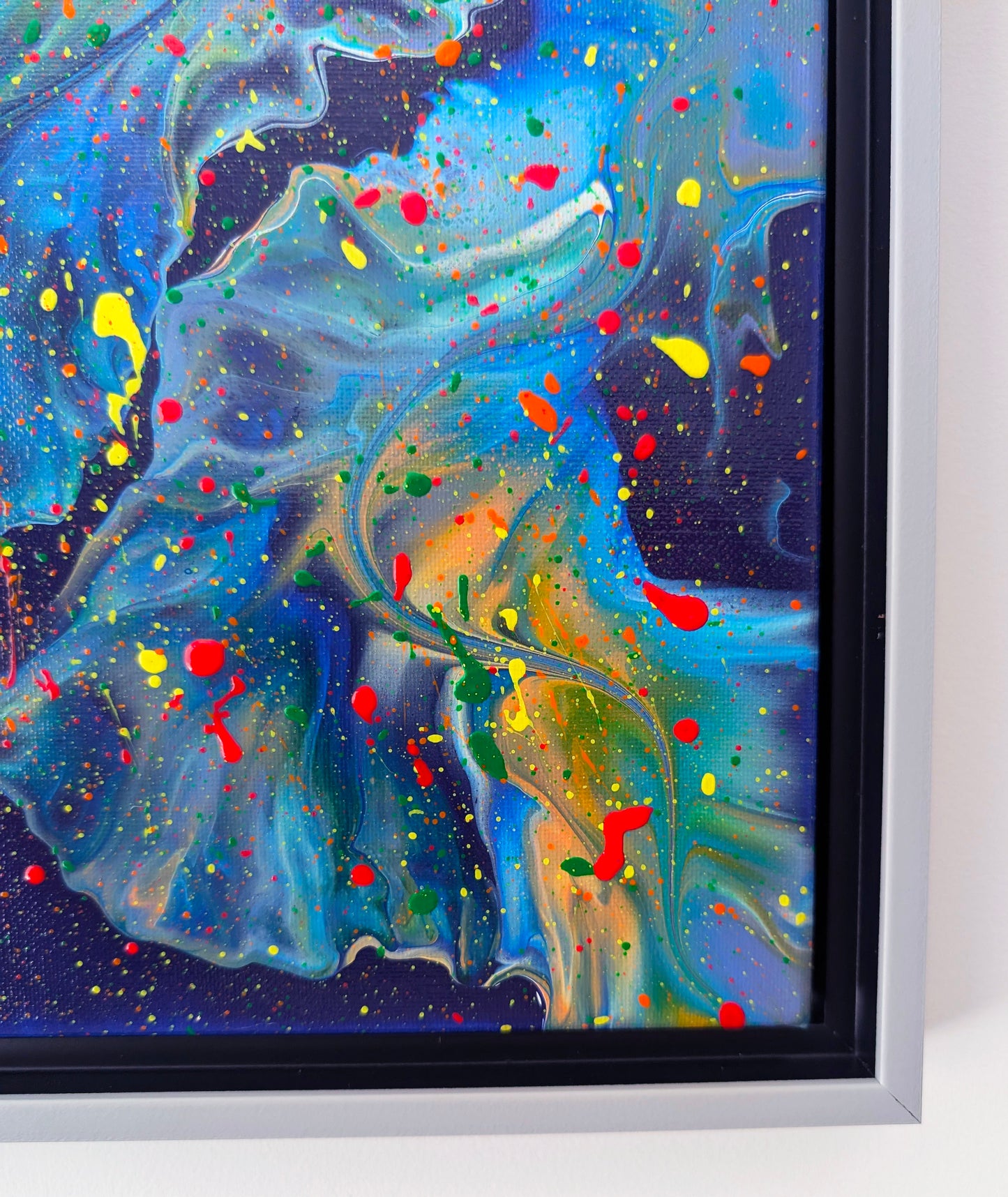 Close-up of the lower section of the artwork, showing intricate swirling textures in blue and purple with bright color splatters layered on top.