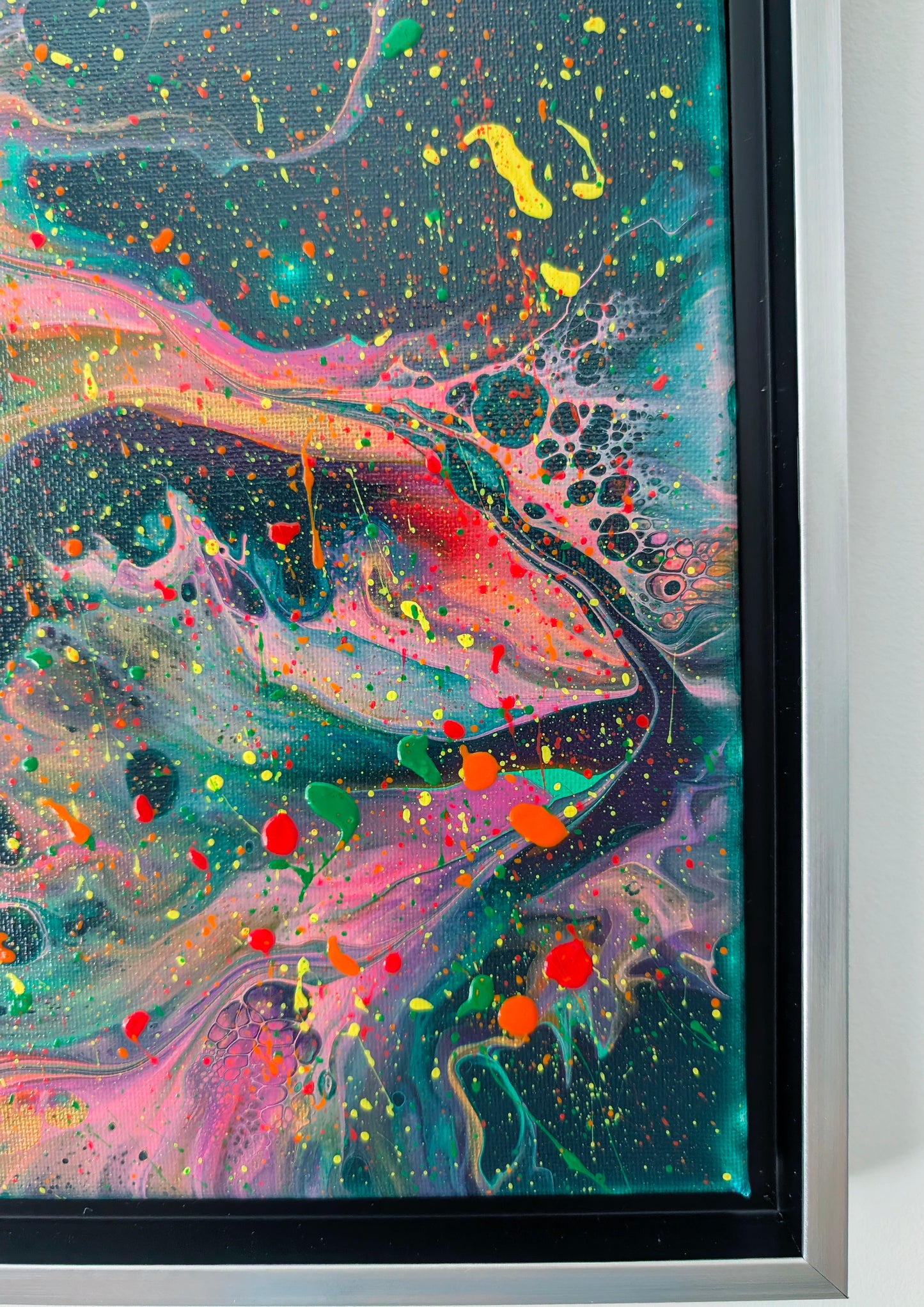 Macro close-up of the lower right section of the painting, focusing on bright green and orange details, neon pink drips, and intricate lacing effects against a rich green background