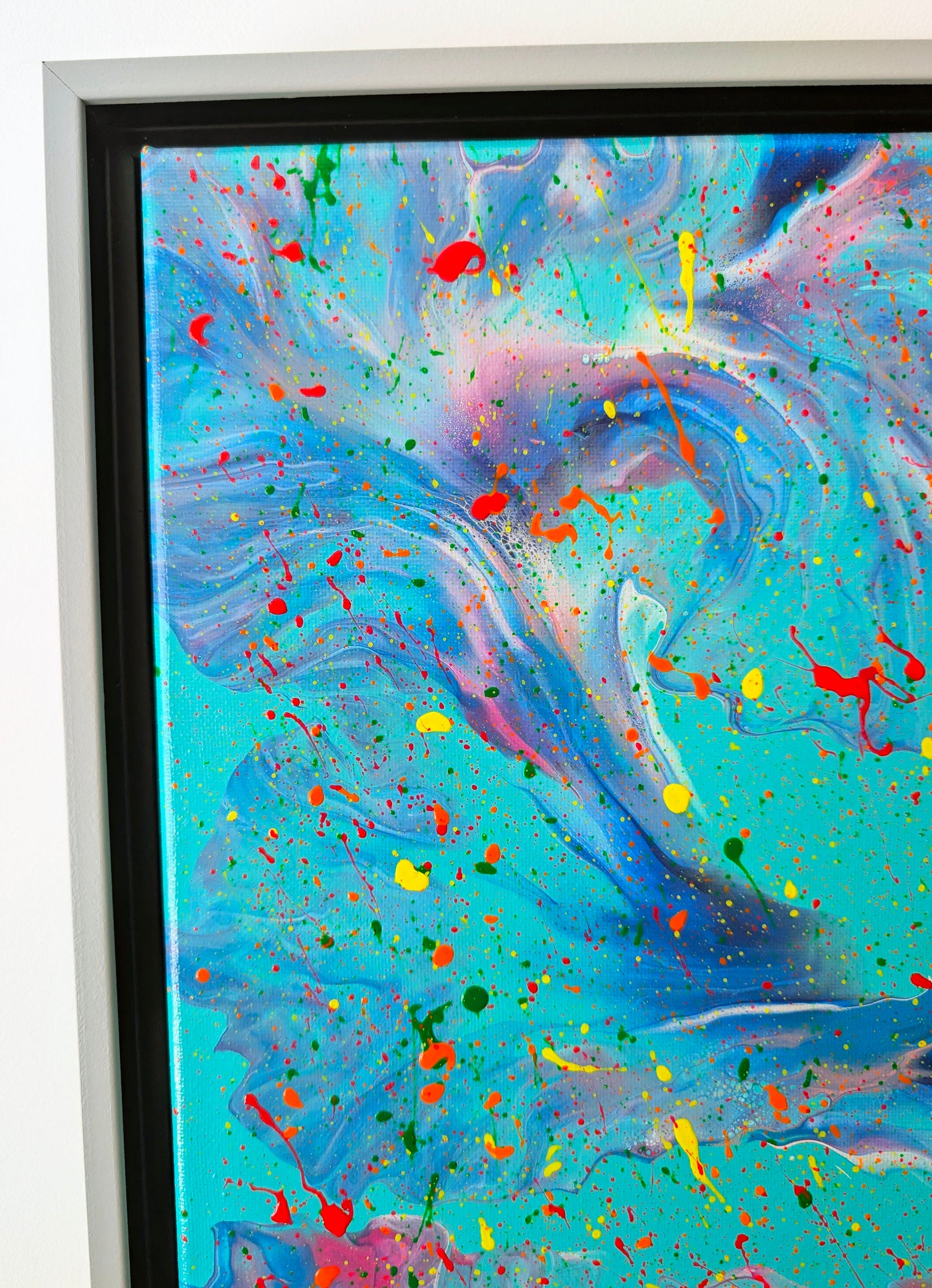 Close-up of the top left corner of the painting showing intricate marbling of purples, pinks, and blues blending into the turquoise background, with bold splatters of neon red, yellow, and green.